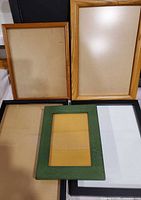 Five frames: 2 natural wood, 2 black, 1 green displayed together