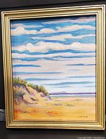 Front view of framed oil painting showing beach scene and frame condition