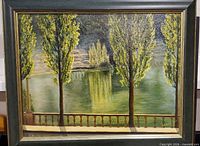 Framed oil painting showing poplar trees and lake