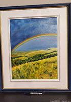 Full view of framed rainbow landscape oil painting