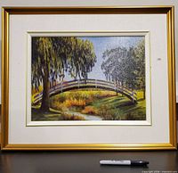 Front view of framed painting showing subject, frame and signature