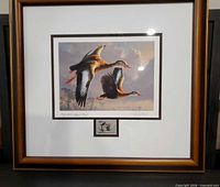 Full view of framed print showing ducks artwork, matting, stamp and frame