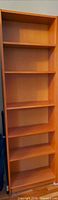 Front view of tall Ikea Billy bookcase showing six shelves