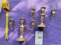 Both candelabra with tape measure and lot card