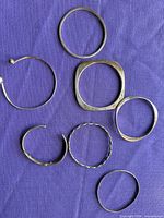 Seven bangles laid out showing overall assortment