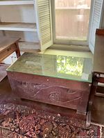 overall view of wood trunk with glass top