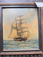 Framed oil painting of sailing ship, full view