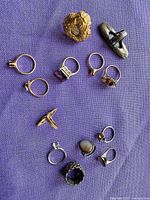 Group overview of all rings on purple cloth