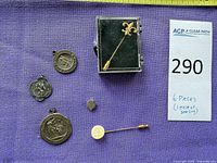 All six pieces laid out on purple fabric with tape measure for scale