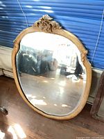 Full view of wood framed Rococo style wall mirror