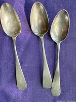 Three sterling teaspoons front view