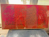 Full view of framed typographic artwork showing colors and frame