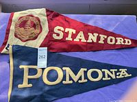 Stanford and Pomona felt pennants side by side