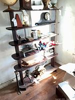 Front view of five-tier mahogany-tone wood etagere