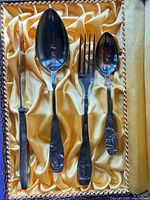 Four silver-plated utensils in satin-lined case