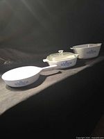 All three cookware pieces lined up side view