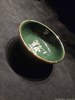 Top view showing interior gold dancing figures and green glaze