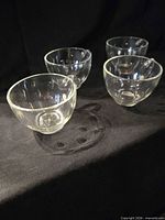 Four clear Hazel-Atlas Teardrop cups grouped