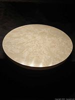 Top view of round Lazy Susan showing faux marble surface