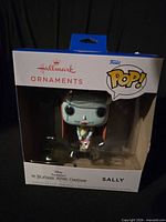 Front of boxed Hallmark Funko Pop Sally ornament