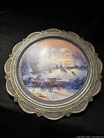 Front view of round collector plate showing full image and border detail