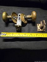 Doorknob set with measuring tape showing length and separate lever latch