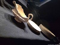 Gravy boat and two stacks of plates overview