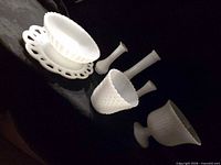 Group of six white milk glass pieces displayed together