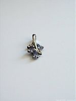 Front view showing gemstone cluster and bale