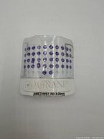 Front view of Rio Grande card showing grid of purple amethyst stones