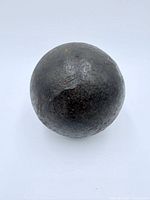 Front view of entire cast iron cannonball