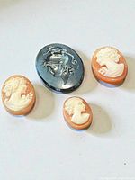 All four loose cameos on white background