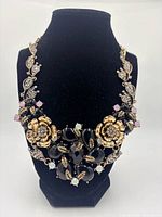 Necklace displayed on black bust showing overall design