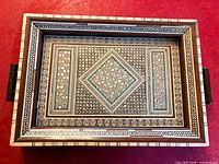 Top view of tray showing full marquetry pattern and handles