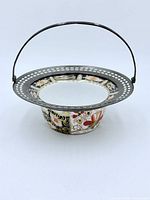 Front view showing bowl, silver rim and handle