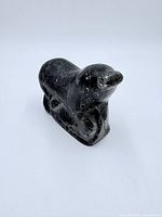 Front angled view of soapstone seal sculpture