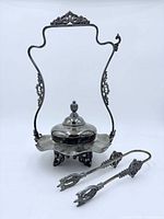 front view showing full assembled pickle castor with tongs