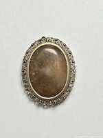 Front view showing oval agate cabochon and filigree sterling silver frame