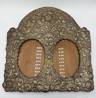 Front view showing full ornate silver frame and dual openings