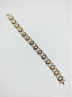 Full view of entire seashell link bracelet showing length and clasp