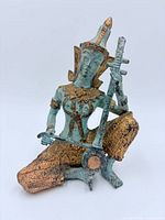 Front view of bronze Thai musician statue showing instrument, verdigris patina and gilded accents