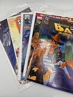 Front view showing all five comics in sleeves