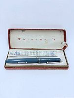 Open Waterman’s case showing blue fountain pen and leaflet