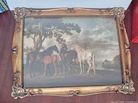 Front view of framed equestrian print showing artwork and ornate frame