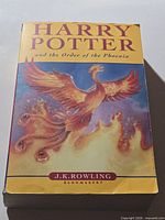 Front cover showing title, author, phoenix artwork, Bloomsbury imprint