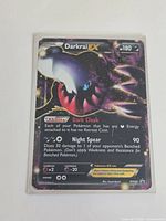 Front of Darkrai EX card showing artwork, stats and promo number