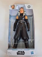 Front of unopened boxed Ahsoka Tano figure showing figure, accessories and branding.