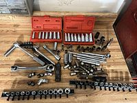 Overall lot showing sockets, ratchets, torque wrench, extensions, red cases