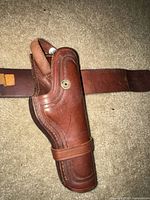 Overall view of Browning leather holster attached to belt