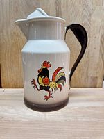 Front view showing rooster motif and overall coloration